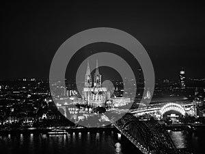 Aerial night view of St Peter Cathedral and Hohenzollern Bridge