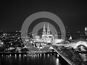 Aerial night view of St Peter Cathedral and Hohenzollern Bridge