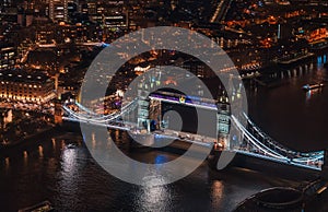 Aerial night view of Tower Bridge over river Thames in London