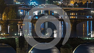 Aerial night view of the Vltava River and illuminated bridges timelapse, Prague