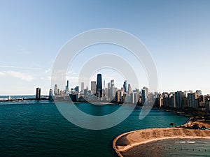 Aerial of North Avenue Beach of lake Michigan in Lincolns park in Chicago against the city skyline