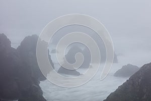 Aerial of Ocean and Foggy Sea Stacks in Northern California