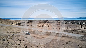 aerial of offroad vehicle standing in the desert landscape of Patagonia