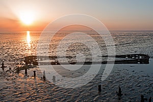 Aerial from an old ship wreck in the Wadden Sea in the Netherlands at sunset