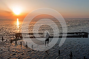 Aerial from an old ship wreck in the Wadden Sea in the Netherlands at sunset