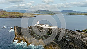 Aerial orbit view of Valentia Island Lighthouse at Cromwell Point. Ireland.