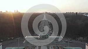 AERIAL: Over 17th of June Street and Tiergarten with Berlin Victory Column revealing Brandenburg Gate in beautiful