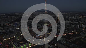 AERIAL: Over Berlin Germany TV Tower Alexanderplatz at Night with City Lights traffic