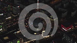 AERIAL: Over Berlin Germany TV Tower Alexanderplatz at Night with City Lights traffic