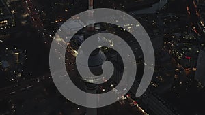 AERIAL: Over Berlin Germany TV Tower Alexanderplatz at Night with City Lights traffic