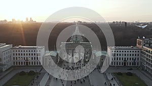 AERIAL: Over Brandenburg Gate with view on Tiergarten and Berlin Victory Column in beautiful Sunset light