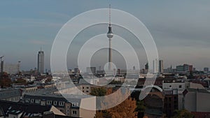 AERIAL: Over colourful Berlin, Germany city center in Fall colors Red, orange and yellow with view of alexanderplatz at