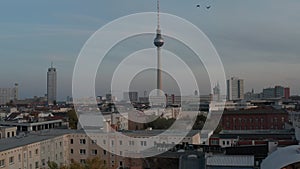 AERIAL: Over colourful Berlin, Germany city center in Fall colors Red, orange and yellow with view of alexanderplatz at