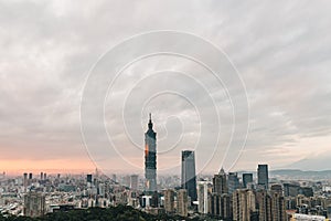 Aerial over Downtown Taipei with Taipei 101 Skyscraper in the dusk from Xiangshan Elephant Mountain in the evening