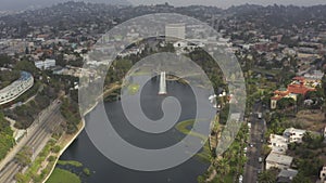 AERIAL: Over Echo Park in Los Angeles, California with Palm Trees, Cloudy