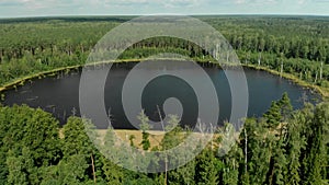 Aerial over forest lake in Russia