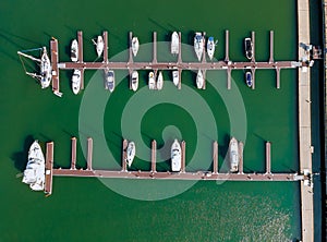 Aerial over small marina on a dock basin in small harbor, aerial view