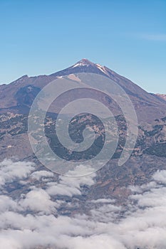 Aerial overcloud view on Tenerife island from airplane