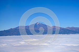 Aerial overcloud view on Tenerife island from airplane