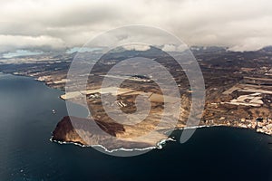 Aerial overcloud view on Tenerife island from airplane