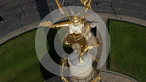 AERIAL: Overhead Birds Eye Drone View Berlin Victory Column Statue Victoria tilting to view City Scape of Berlin