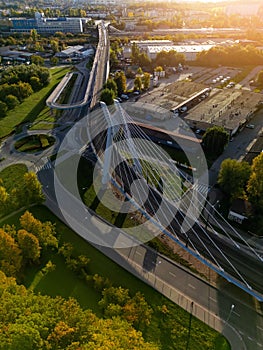 Aerial overhead drone photo of modern suspension bridge, buildings in Krakow, Poland