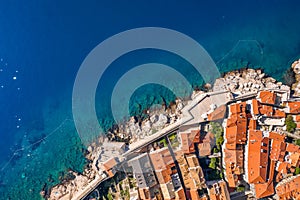 Aerial overhead drone shot of Dubrovnik old town city wall by Adriatic sea in Croatia summer