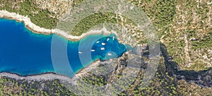 Aerial overhead drone shot of Stiniva covert cove beach in Adriatic sea on Vis Island in Croatia in summer photo