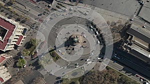 AERIAL: Overhead Shot of Columbus Monument Roundabout in Barcelona, Spain with Busy Car traffic on Sunny Day