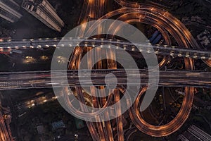 Aerial overhead shot of flyover highway traffic before dawn in Chongqing, China