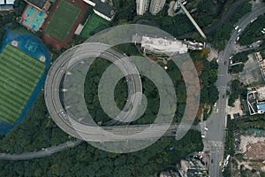 Aerial overhead shot of particular double circle 720 degree flyover in bushes residential buildings in Chongqing, China