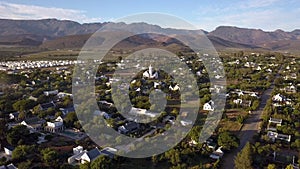 Aerial overhead small town in mountain landscape