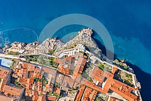 Aerial overhead view of Church of St. Marija in Dubrovnik city wall by Adriatic sea in Croatia summer