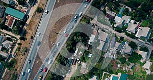 Aerial overlooking the hiway with cars, trucks and other transport.