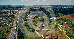 Aerial overlooking the hiway with cars, trucks and other transport.