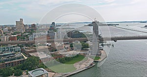 Aerial overview Brooklyn Bridge with american flag East River view Brooklyn New York City Skyline