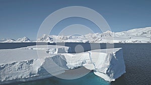 Aerial overview of iceberg among Antarctica ocean.