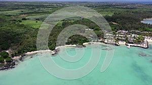 Aerial panning left from Anse La Raie Beach via St Francois Public Beach to Calodyne - aerial video view of Mauritius north coast