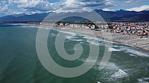 Aerial panning shot of the beach at  Viareggio on the coast of Italy.