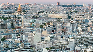 Aerial panorama above houses rooftops in a Paris day to night timelapse