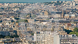 Aerial panorama above houses rooftops in a Paris timelapse