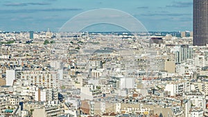 Aerial panorama above many houses rooftops in a Paris timelapse