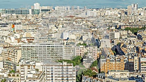 Aerial panorama above many houses rooftops in a Paris timelapse