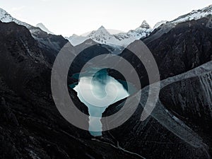 Aerial panorama of blue turquoise alpine mountain lake Laguna Paron in Caraz Huaraz Ancash Cordillera Blanca Peru