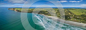 Aerial panorama of Cape Bridgewater beach, settlement, and wind farm in Victoria, Australia.