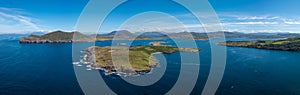 Aerial panorama of the coastal landscape of the Iveragh Peninsula with Beginish and Valentia Island