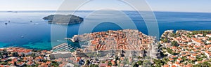 Aerial panorama drone shot of Dubrovink city old town with view of Lokrum island in Croatia summer morning