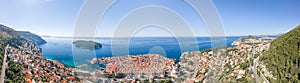 Aerial panorama drone shot of Dubrovink city old town with view of Lokrum island in Croatia summer morning