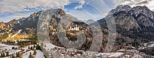 Aerial panorama drone shot of Hohenschwangau in Fussen with view of Neuschwanstein castle in Germany winter