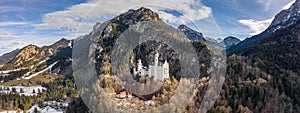 Aerial panorama drone shot of Hohenschwangau in Fussen with view of Neuschwanstein castle in Germany winter